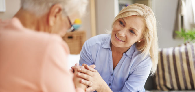 Woman speaking with resident